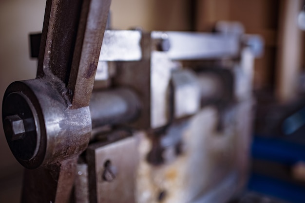 Premium Photo | Guillotine machine close-up rusty metal massive parts