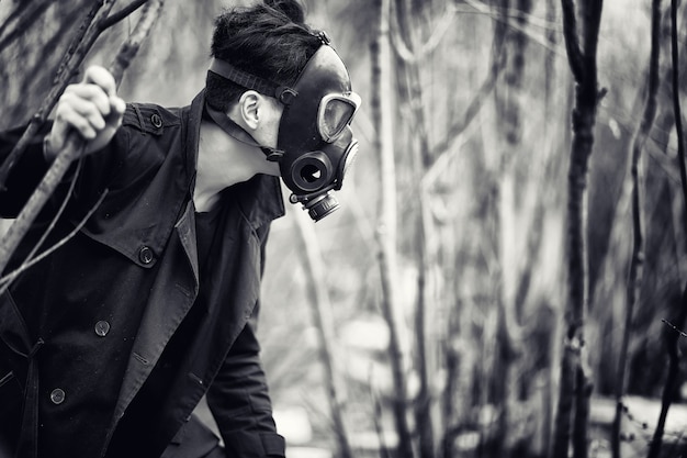 Premium Photo | The guy in the coat and gas mask. post-apocalyptic ...