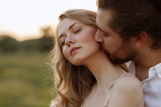 Premium Photo The Guy Kisses The Girl In The Neck Close Up Portrait