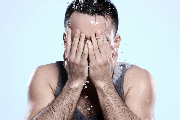 Free Photo | Guy washing his face