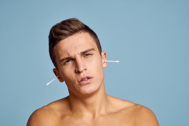 Premium Photo Guy With Ear Sticks And Nude Torso