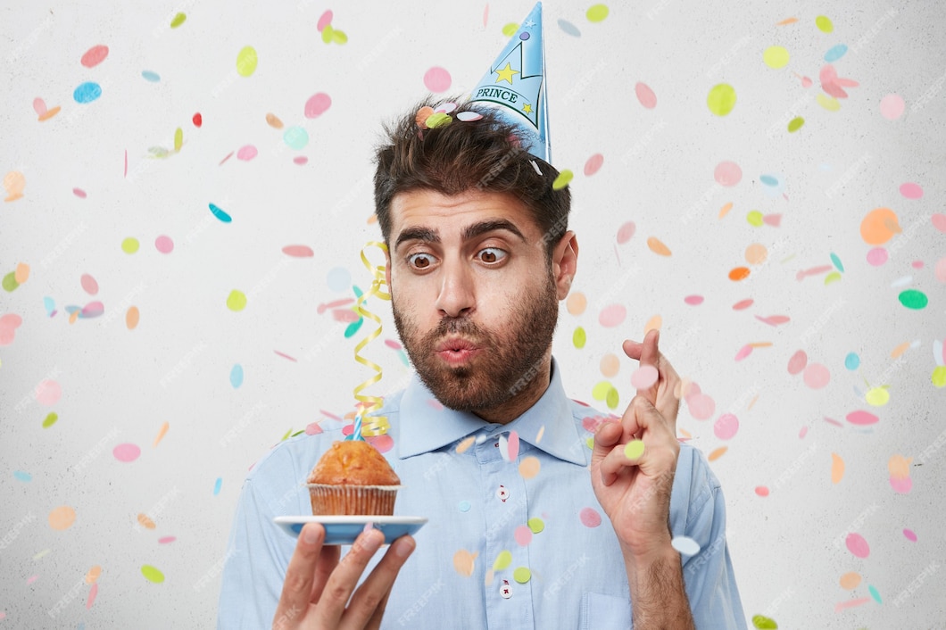 Free Photo | Guy with party hat and confetti