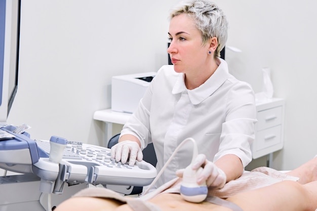 Premium Photo Gynecologist Doing Ultrasound Scan In Modern Clinic 