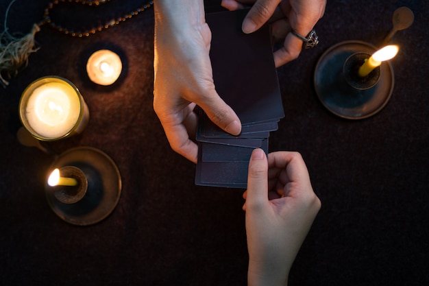 Gypsy fortune tellers are predicting horoscopes for customers using predictive gypsy cards. Premium Photo