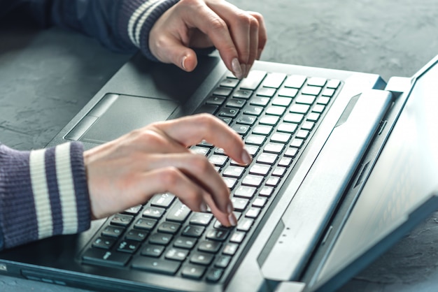 Premium Photo | Hacker the programmer is typing on the keyboard of the ...