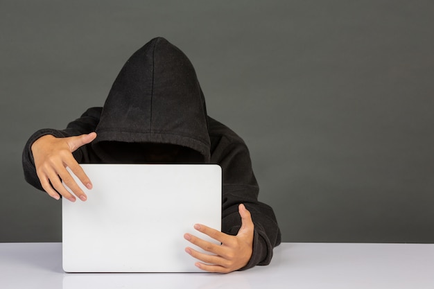 Hacker with a laptop Free Photo