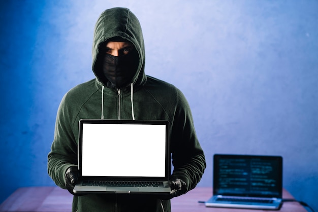 Premium Photo | Hacker with laptop