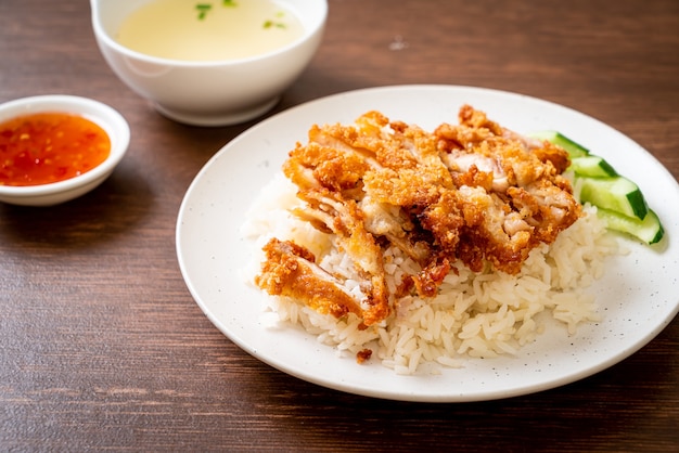 Premium Photo | Hainanese chicken rice with fried chicken or rice ...
