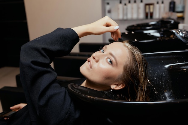 Hairdresser In Beauty Salon Washes His Client Hair Before Procedure Of Applying Natural Restoring Ingredients And Vitamins To Hair And Haircut 152904 13431 