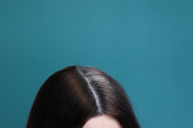 Premium Photo Half Dyed And Gray Hair On A Female Head On A Blue Background Early Graying Concept