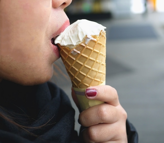 Free Photo Half Face Of Asian Woman Eating Ice Cream Cone