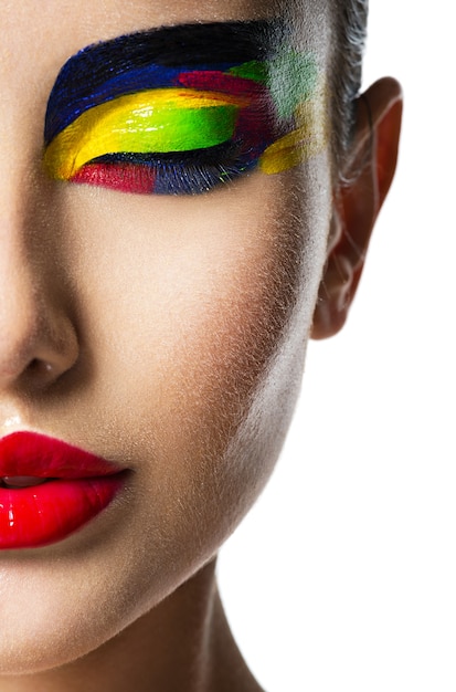 Free Photo | Half face of a beautiful woman with multicolors vivid make ...