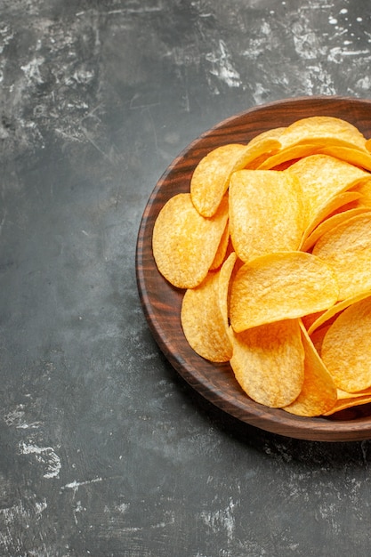 Free Photo | Half shot of tasty homemade potato chips on a brown plate ...