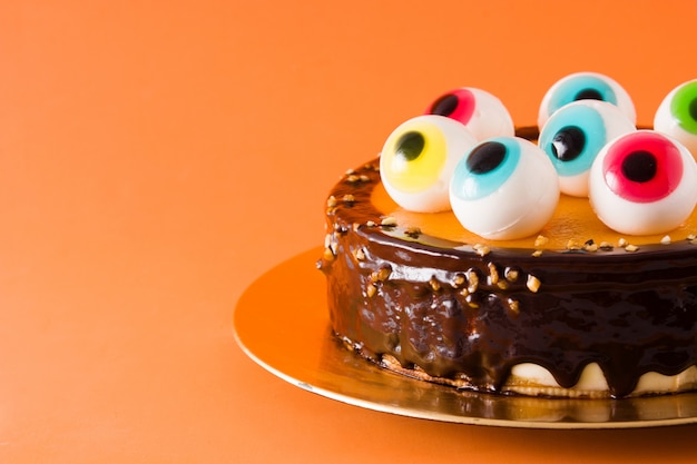 Premium Photo | Halloween cake with candy eyes decoration