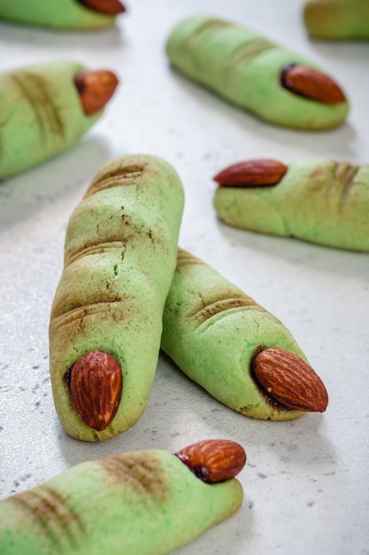 Premium Photo Halloween Cookies Witch Green Fingers With Almond Nails