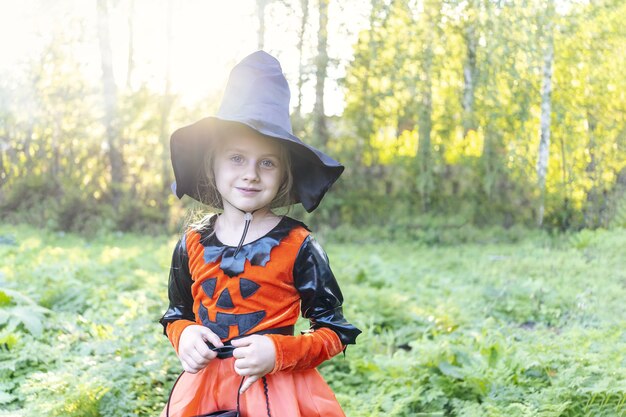 Premium Photo | Halloween cute girl going to collect candy trick or ...