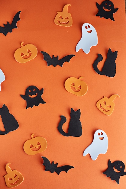 Premium Photo | Halloween decorations, pumpkins, bats and ghosts on ...