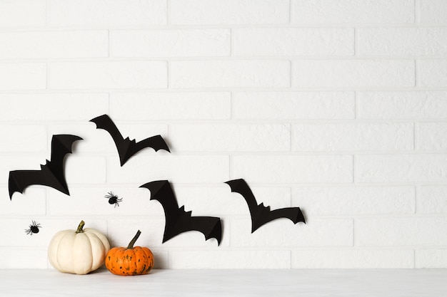 Premium Photo | Halloween decorations on white brick wall