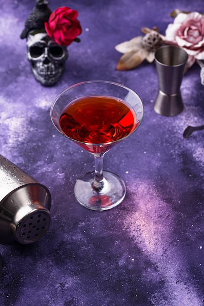 Premium Photo | Halloween martini cocktail on purple background