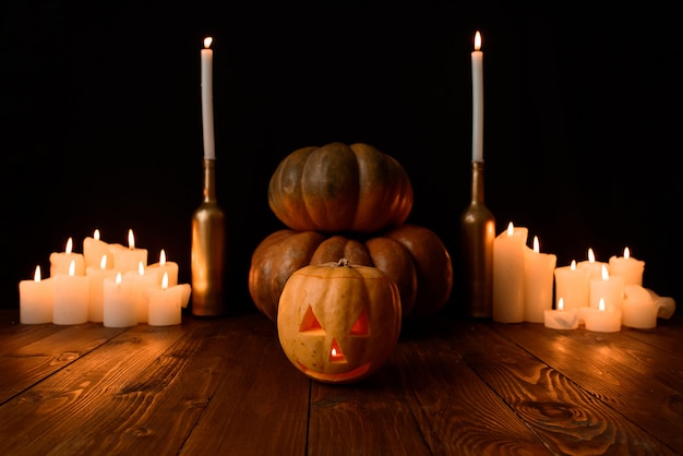 Premium Photo | Halloween pumpkins with candles