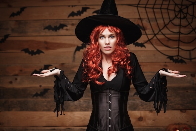 Premium Photo | Halloween witch concept - happy halloween red hair ...