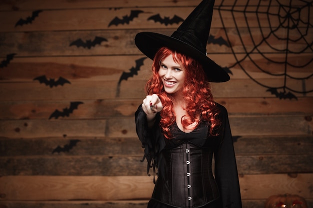 Premium Photo | Halloween witch concept - happy halloween red hair ...