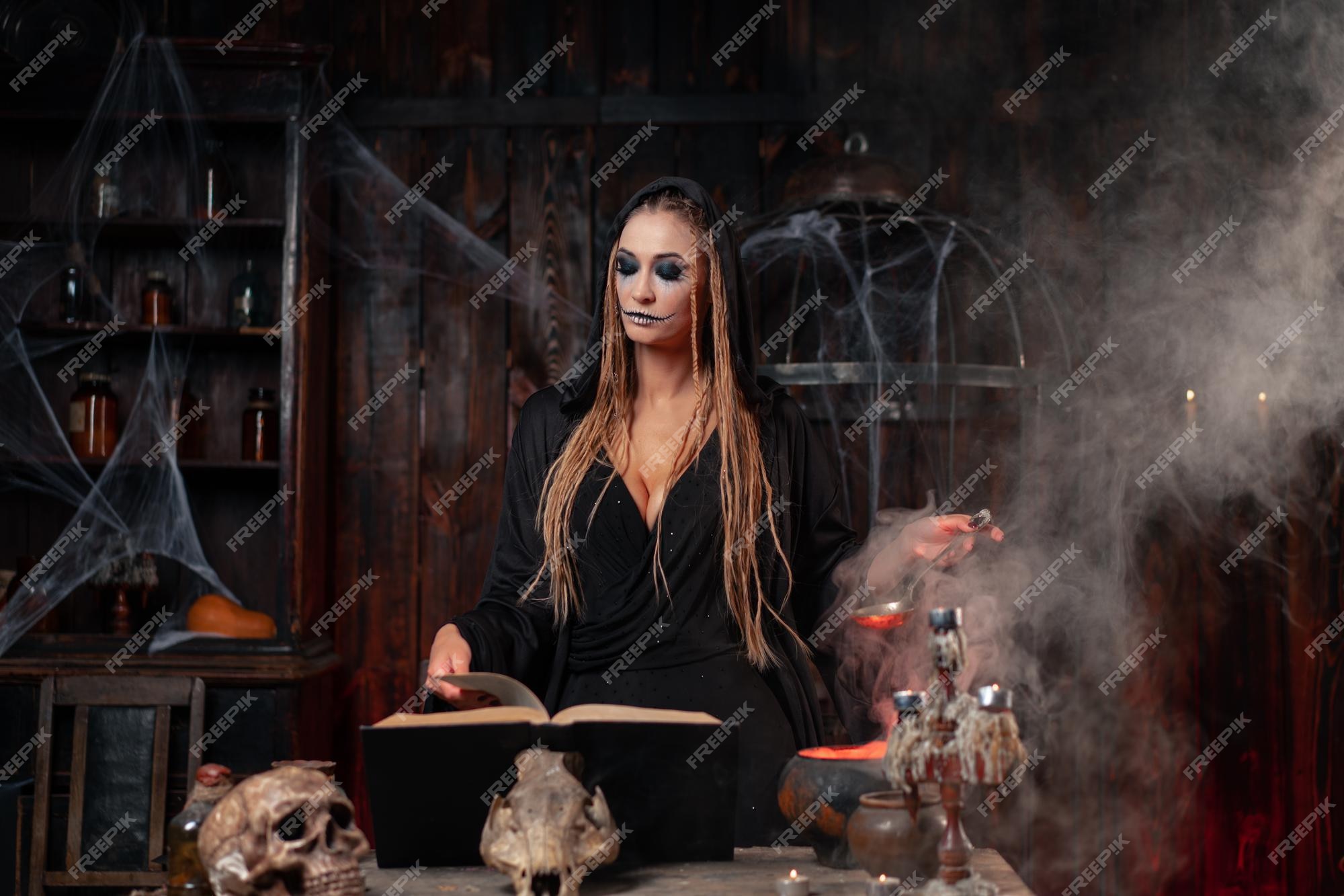 Premium Photo | Halloween, witch use magic book and cauldron prepare ...