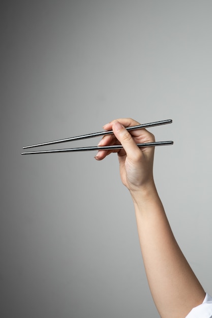 Premium Photo | Hand chopstick asian japanese chinese food style ...