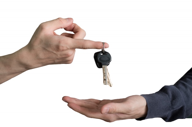 Premium Photo | Hand handing over car keys with finger and hand receiving