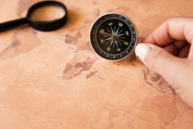 hand holding compass