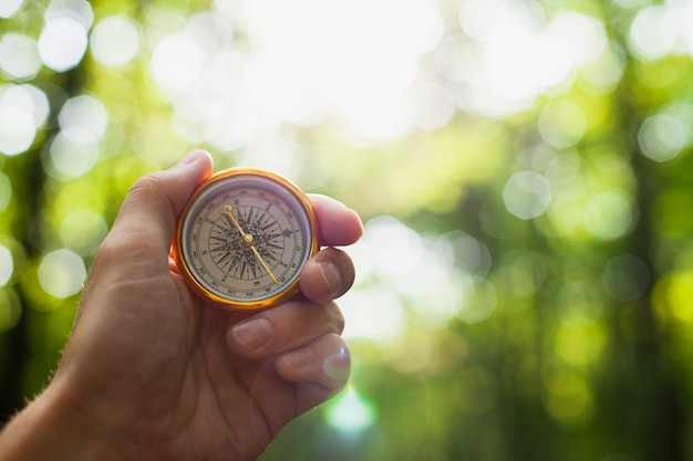 hand holding compass