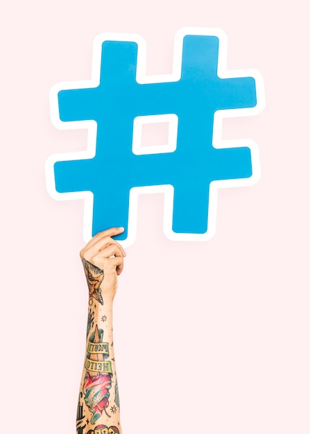 Free Photo Hand  holding hashtag  symbol
