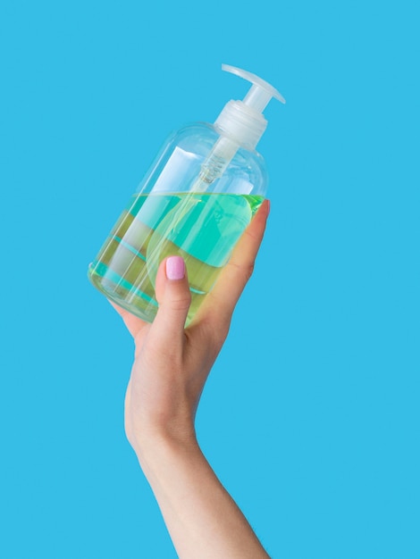 Free Photo | Hand holding liquid soap in plastic bottle