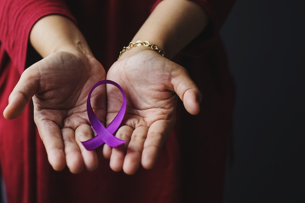 Premium Photo Hand Holding Purple Ribbon For Alzheimers Disease