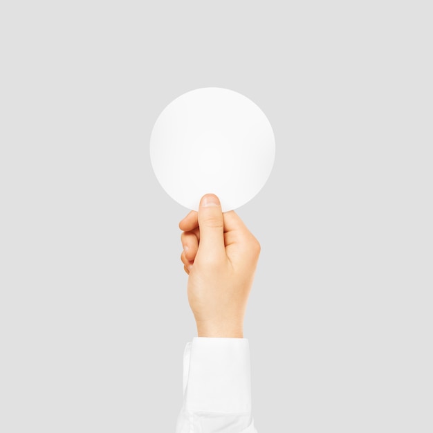 Download Hand holding round blank white sticker mock up | Premium Photo