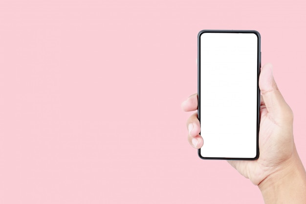 Premium Photo Hand Holding Smartphone Mockup On Pink Pastel Background With Copy Space