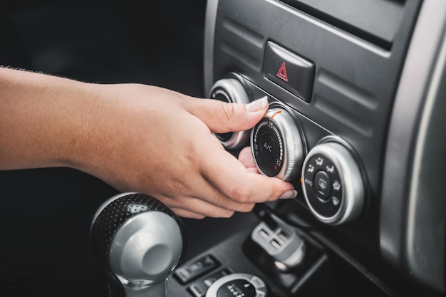Hand manipulation of air conditioning Free Photo