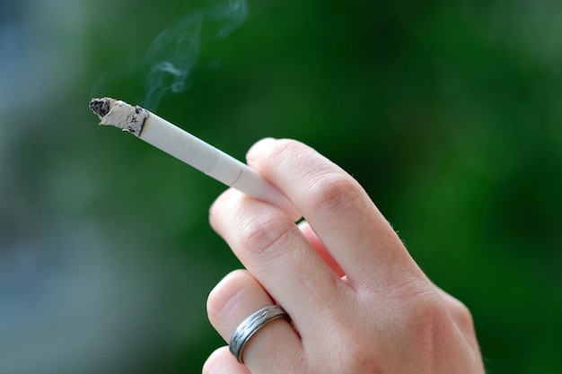 Hand of smoking person  Photo | Free Download