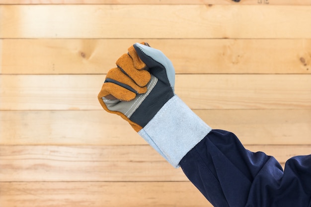 Hand In Rough Leather Glove Premium Photo