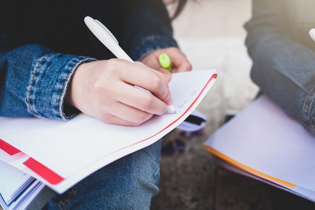 Premium Photo | Hand writing notes in a notebook