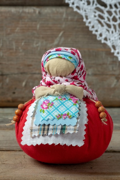 Premium Photo | Handmade amulet doll on a wooden table