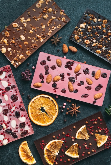 Premium Photo | Handmade chocolate bars with a variety of dried fruit ...