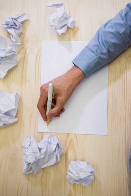 Free Photo | Hands of business executive writing on blank paper