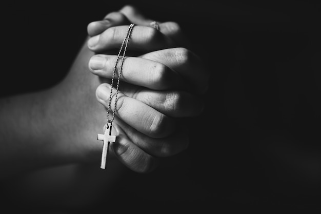 Free Photo Hands Holding Cross While Praying