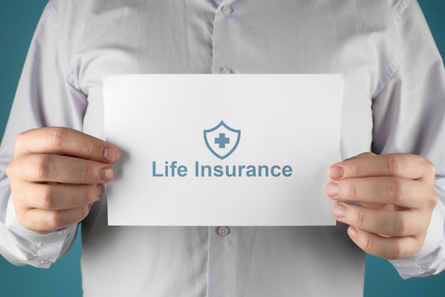 Free Photo | Hands holding life insurance note close up