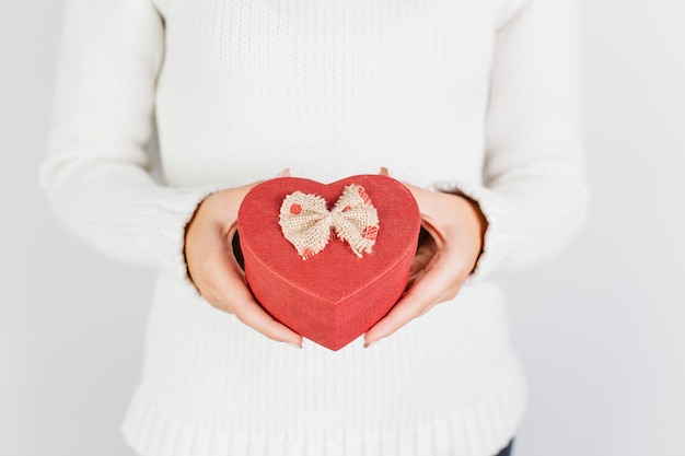 Free Photo | Hands holding red heart shaped gift box