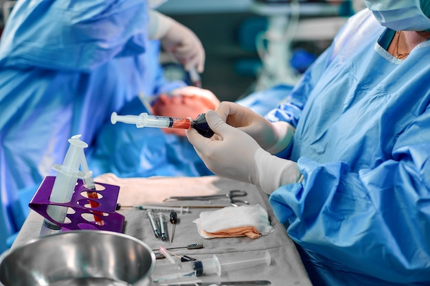 Premium Photo | Hands holding syringe and transfer fat with nano fat ...