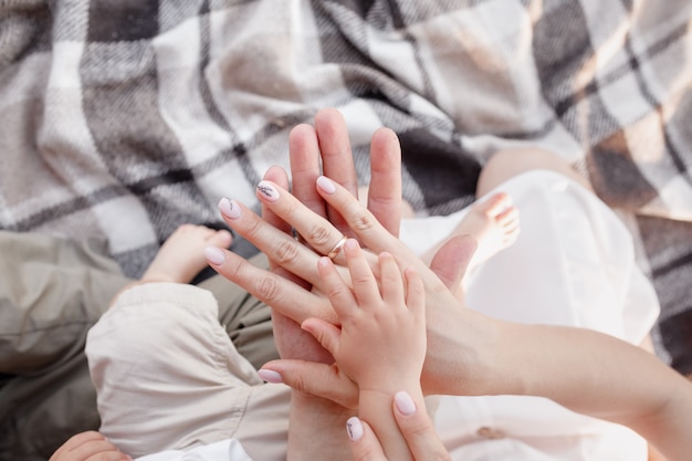 Premium Photo Hands Of Mom Dad And Baby Son