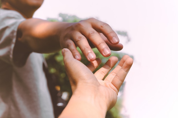 premium-photo-hands-reaching-out-to-help-each-other