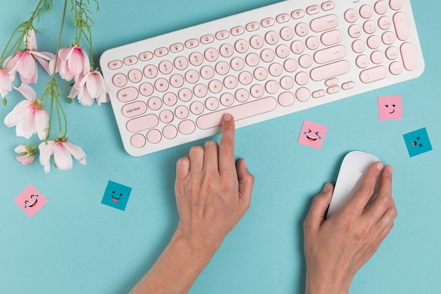 Hands using keyboard and mouse Free Photo